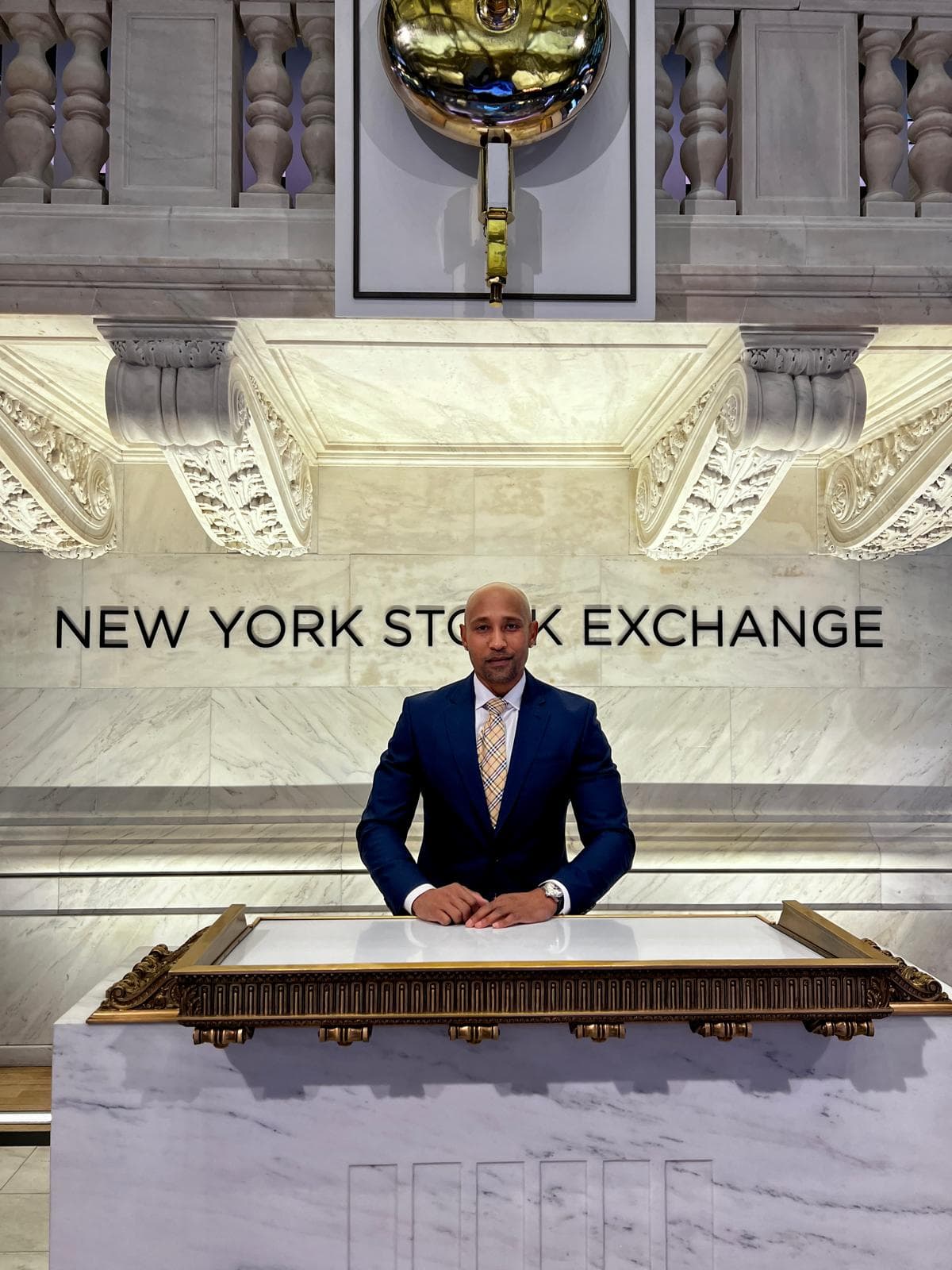 Jonas Muthoni at the New York Stock Exchange bell podium